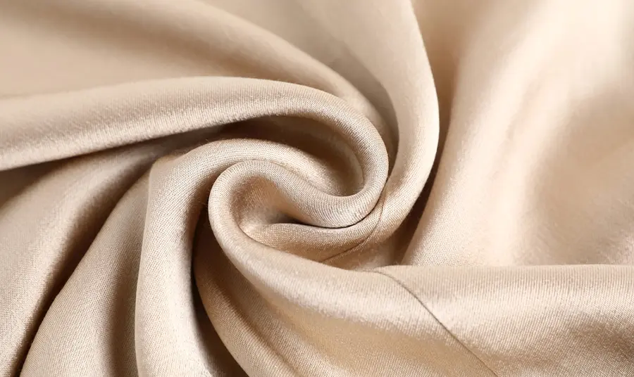 Woman examining greenhouse plants
